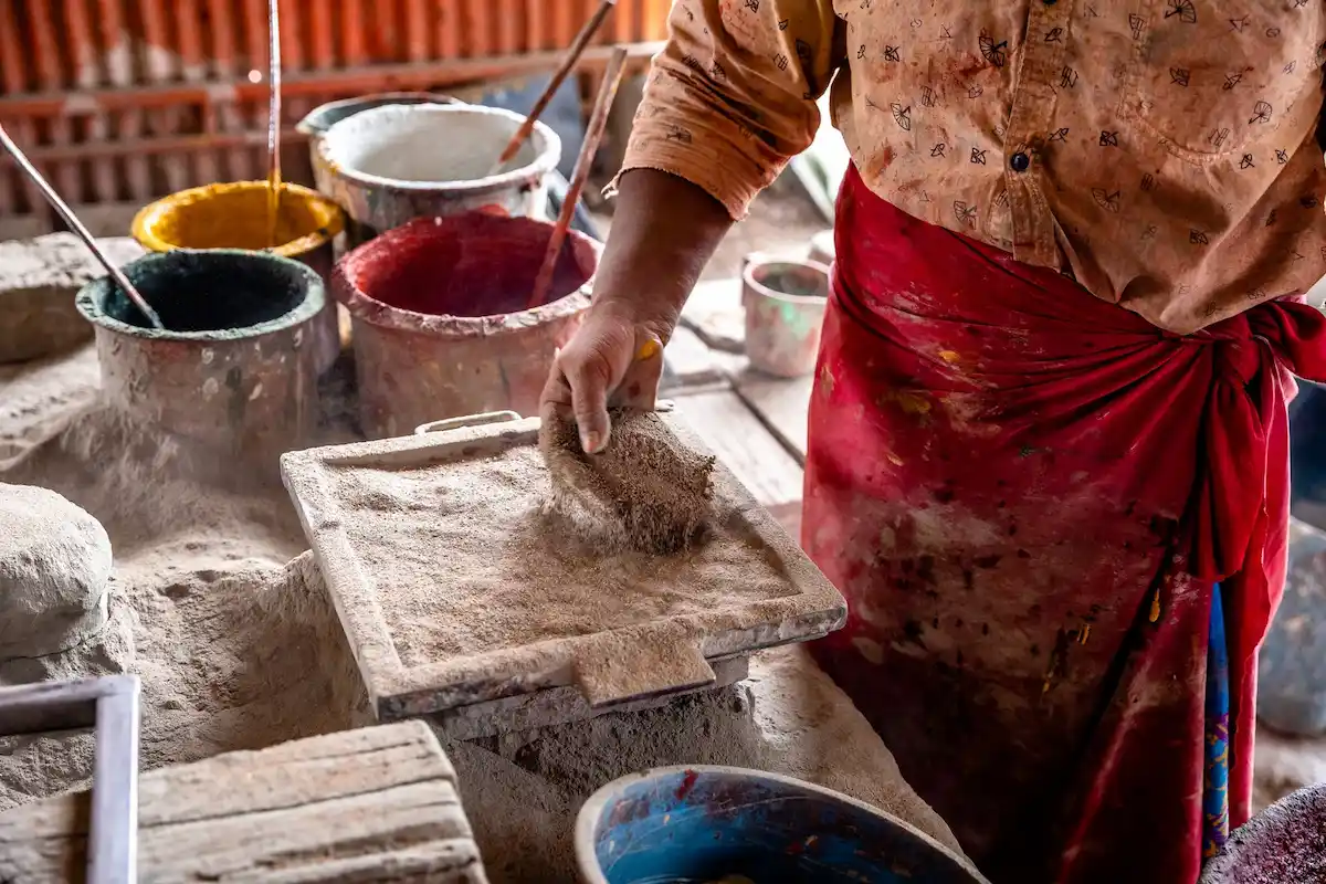 Artisan working on the handmade Athangudi tile making process