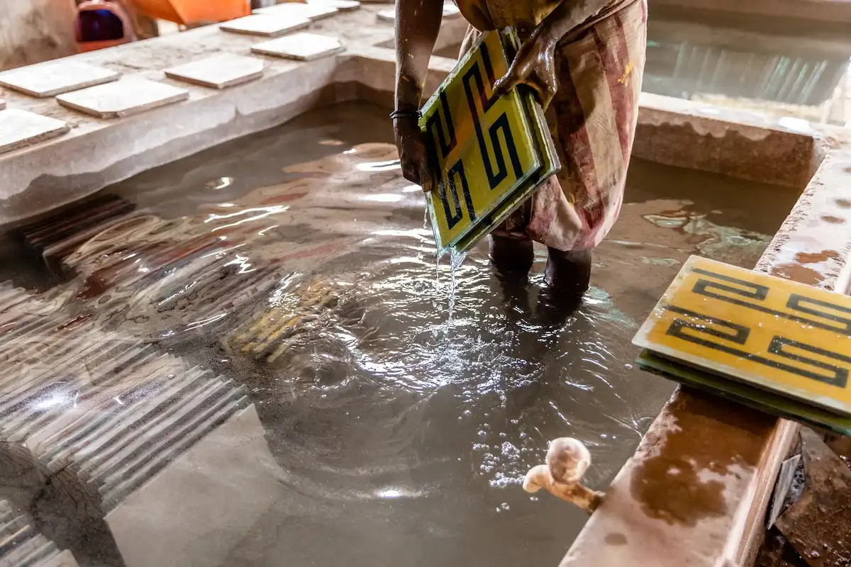 Handmade Athangudi tiles being washed